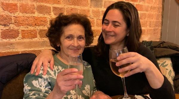 Zoe and Koula raising glasses of wine