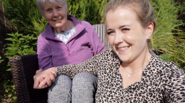 Lara and her mum, Sandee, sat in the garden taking a selfie