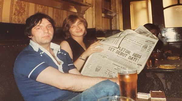 An old photograph of Candy and Stan in the pub reading the sports section of the Manchester Evening News