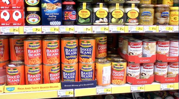 Marmite, oxo cubes and beans stacked on a supermarket shelf