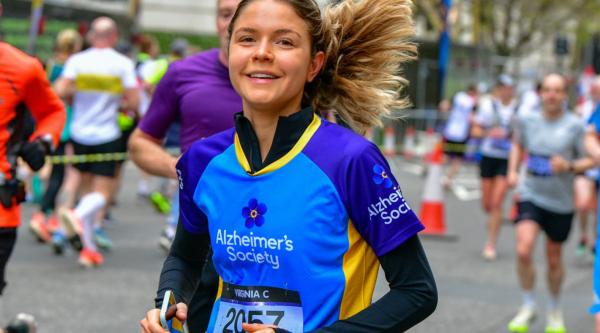 A girl wearing an Alzheimer's Society t shirt is running