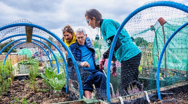 People affected by dementia and volunteers at the Alive gardening allotment