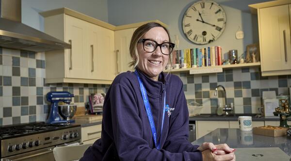 Alzheimer's Society Dementia Adviser Jaime standing in a kitchen