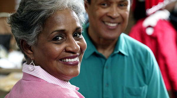 Two older people smiling