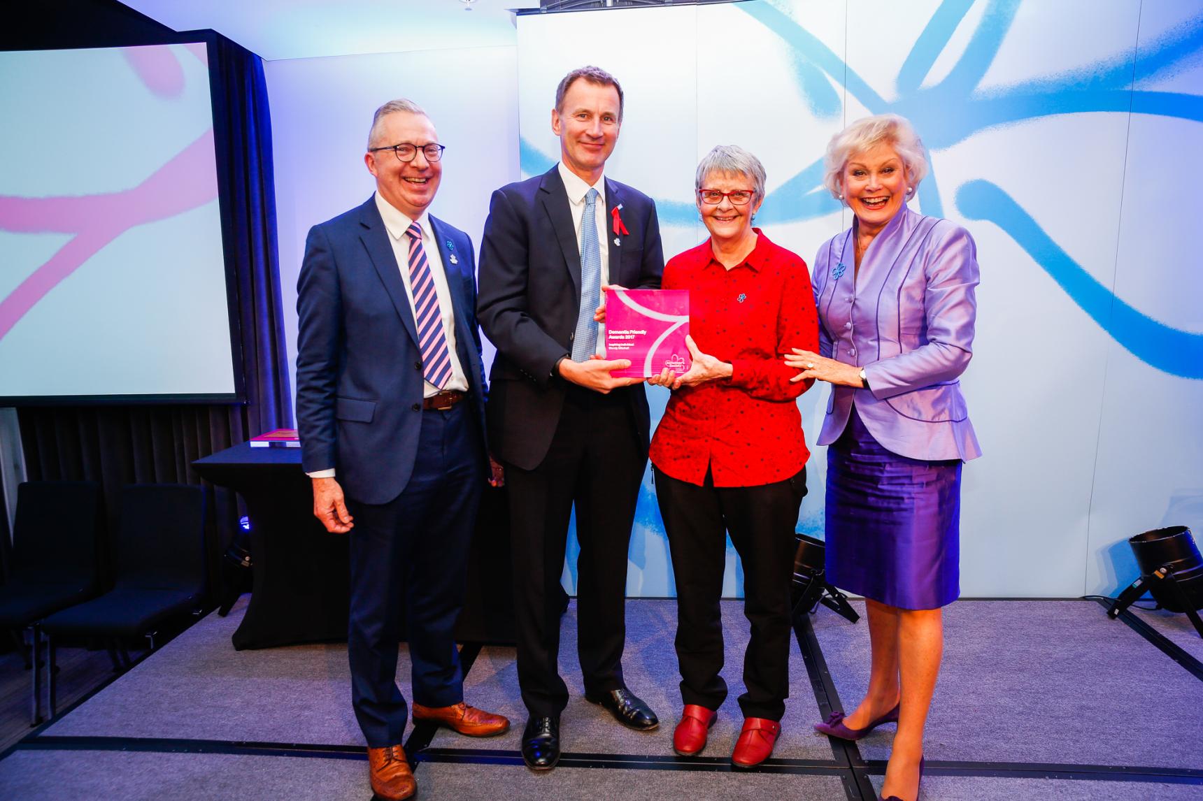 Wendy Mitchell receiving an award