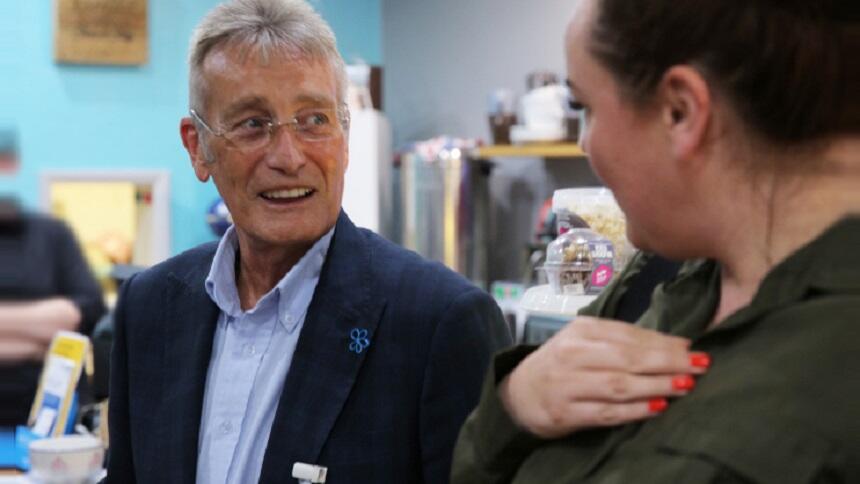 Peter Lyttle talking to a woman