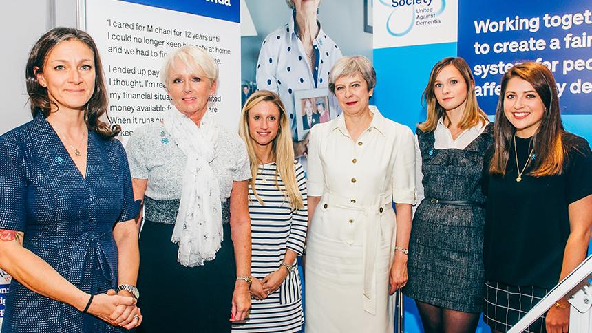 Alzheimer's Society staff and volunteers with Theresa May at the Conservative Party Conference.