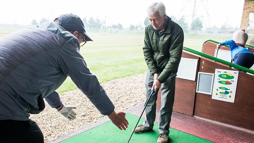 A Golf in Society member receiving advice from a volunteer