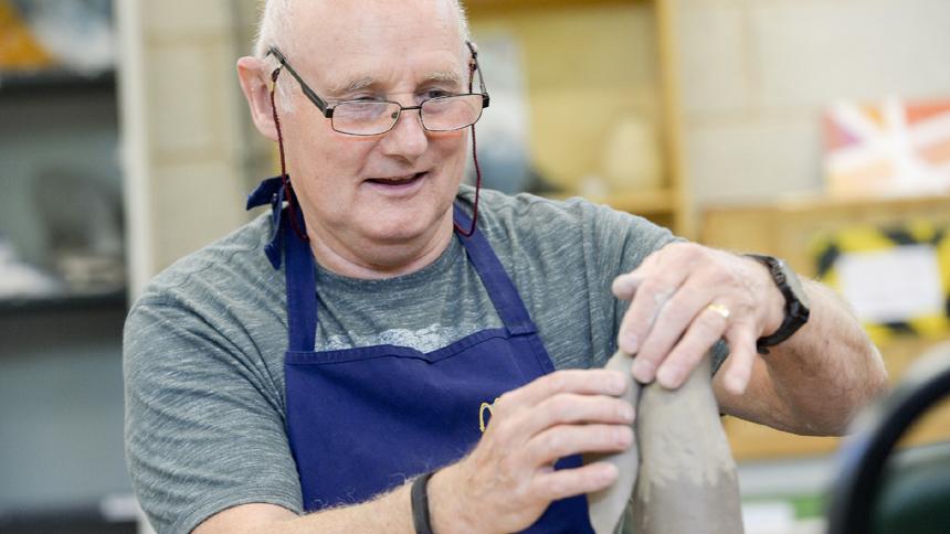 A Wabi Sabi Pottery Group member models a clay hare