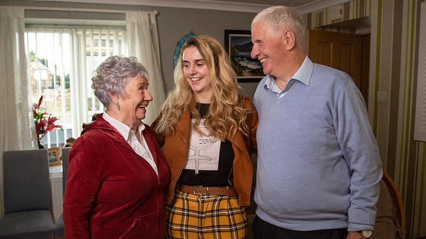 Celine Quinn at home with her husband, Pauric, and granddaughter, Róise.