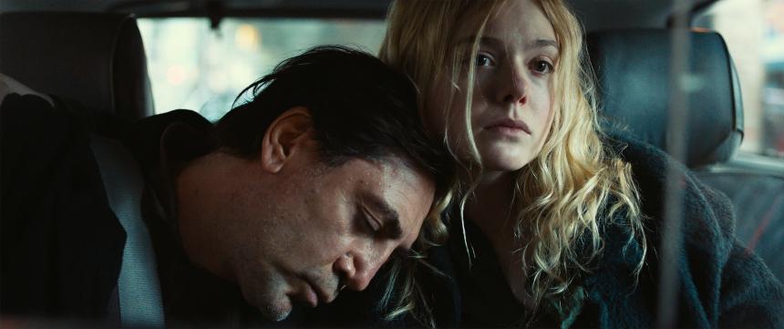 A still from the film The Roads Not Taken, with Bardem and Fanning