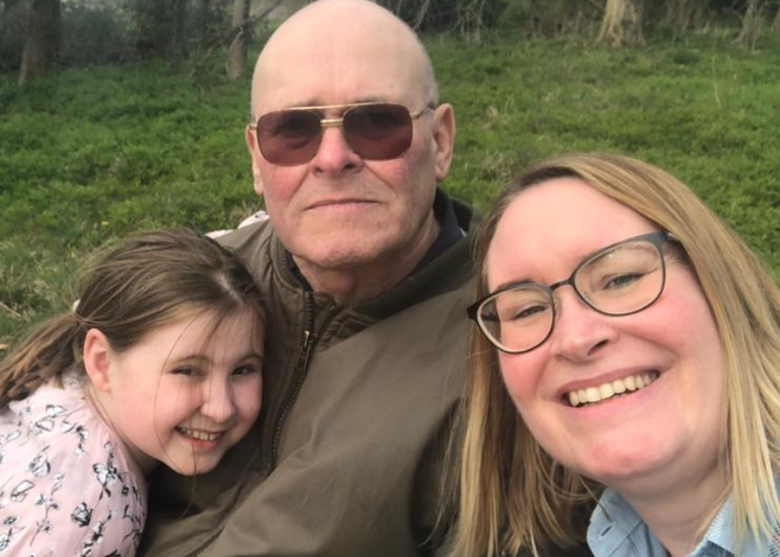 Sara and her daughter smiling with Brian, who has dementia