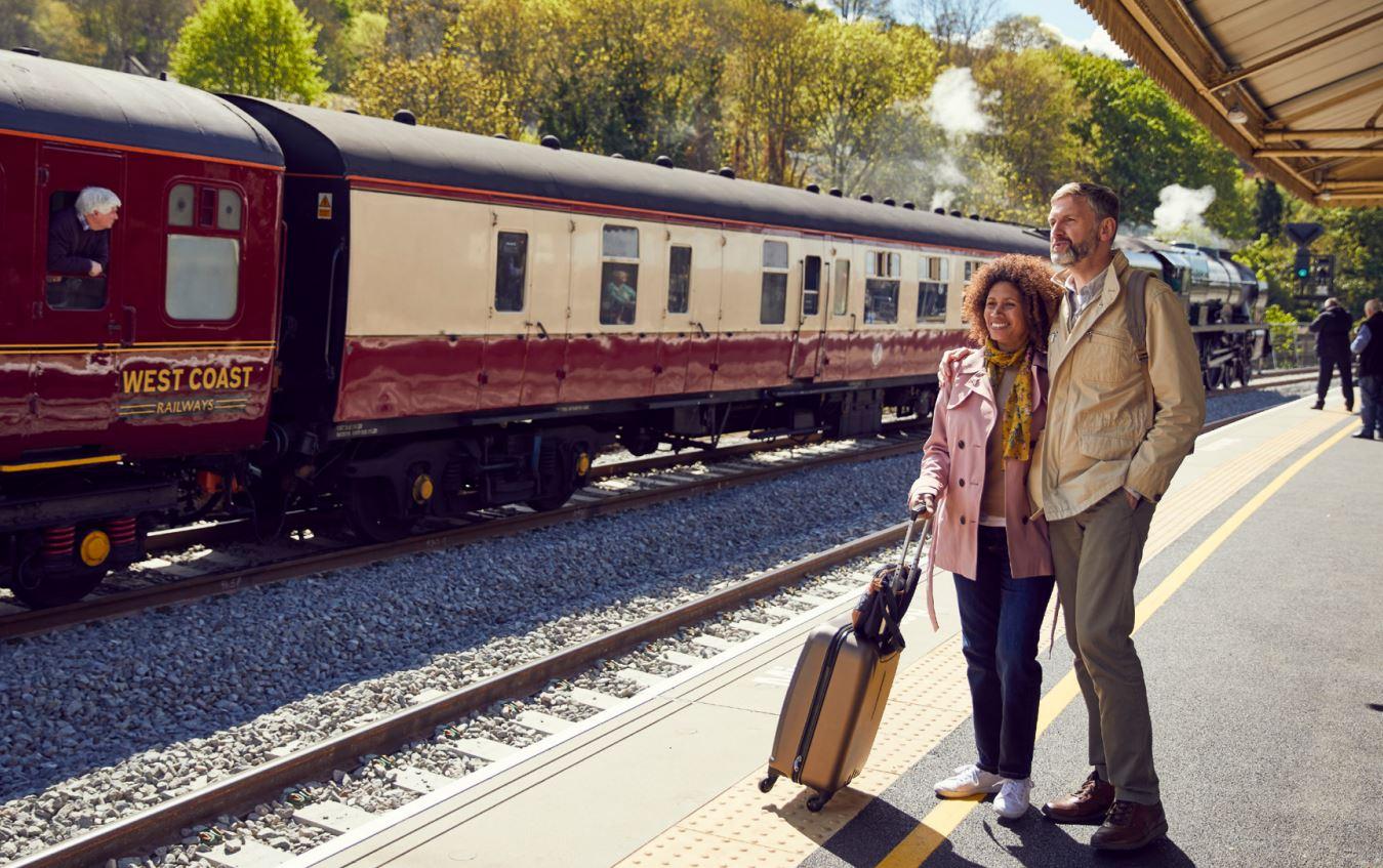 Man and woman standing on train platform