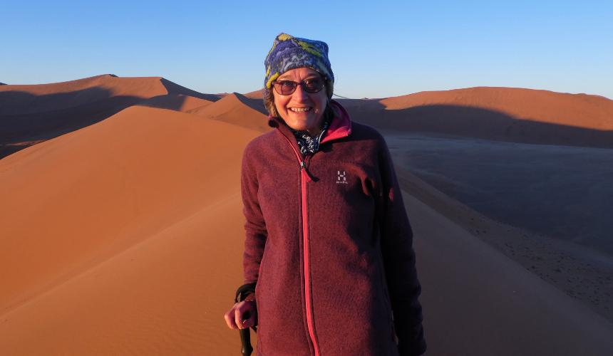 Jane climbing sand dunes in Namibia, 2018
