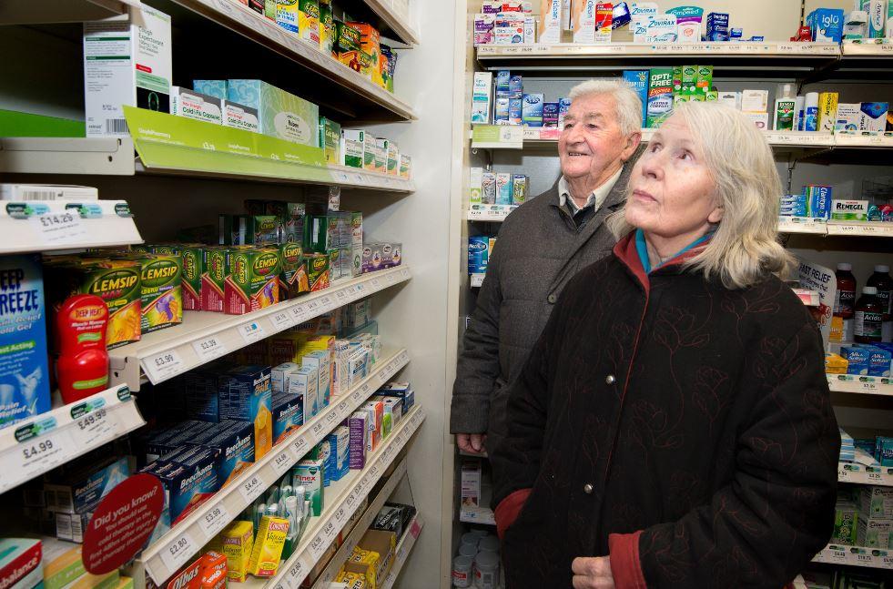 Two people in a pharmacy
