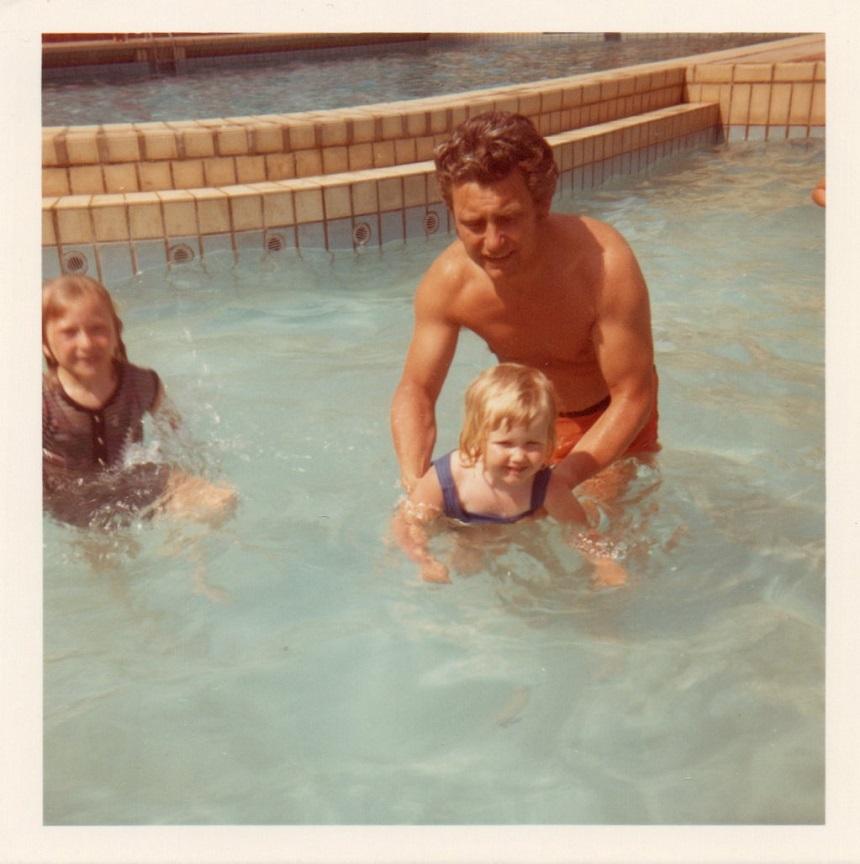 Mandy and her sister swimming with their dad