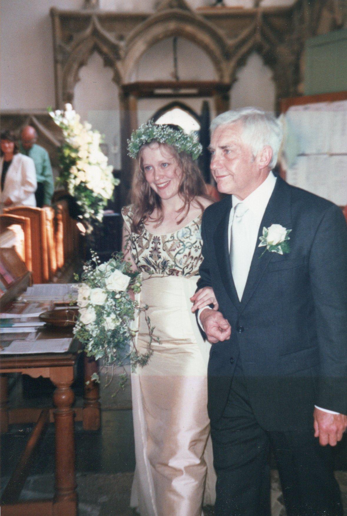 Mandy's dad walking Mandy down the aisle on her wedding