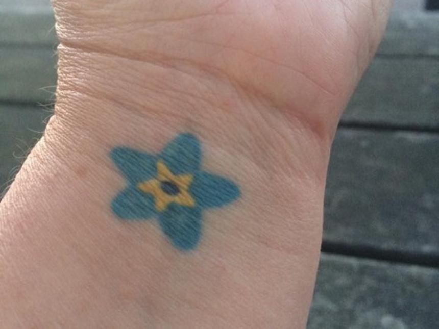 Anna Howard's forget-me-not Dementia Friends tattoo