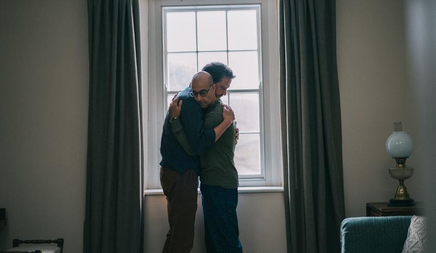 Actors Colin Firth and Stanley Tucci embracing during the film Supernova