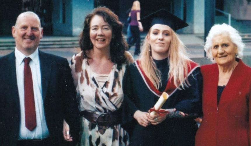 India at her graduation alongside her parents and grandmother