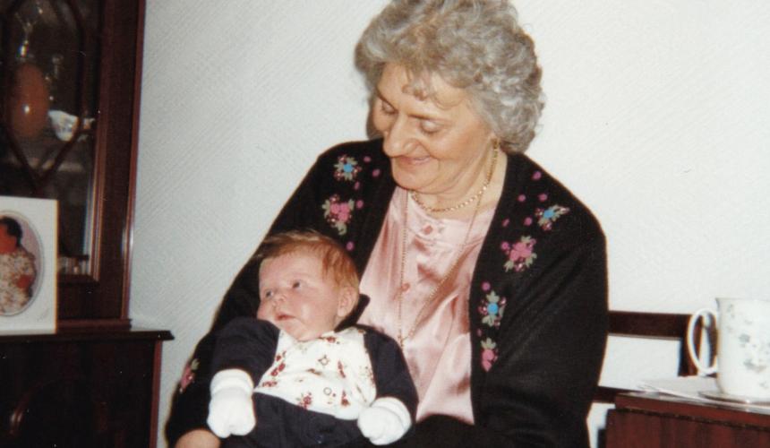 India as a baby held by her grandmother in March 1996