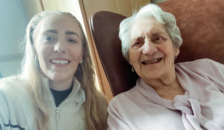 India with her grandmother smiling at the care home in September 2021