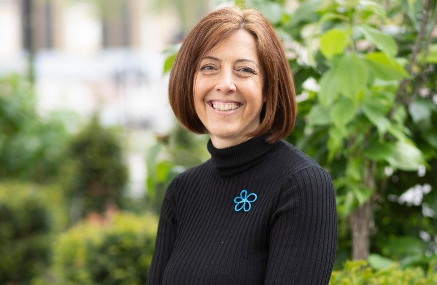 Kate Lee, the CEO of Alzheimer's Society, pictured wearing a forget-me-not Alzheimer's Society badge