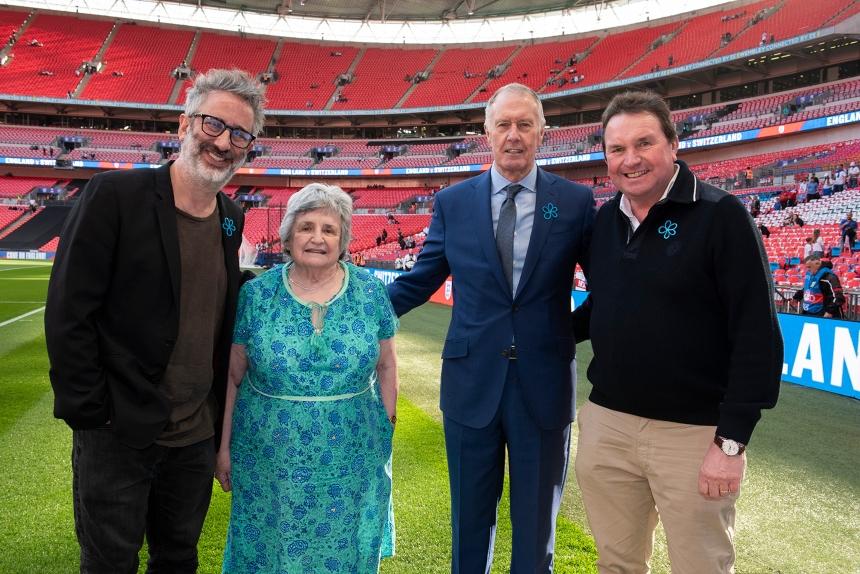 David Baddiel and Sir Geoff Hurst pictured at the match with Shelagh Robinson and Stephen Freer - football fans living with dementia