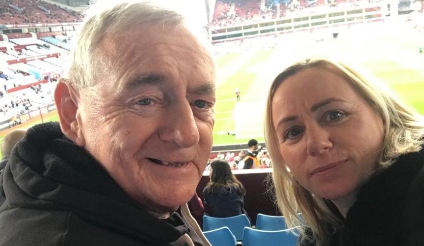 Laura and her dad Peter in a stadium during a football match