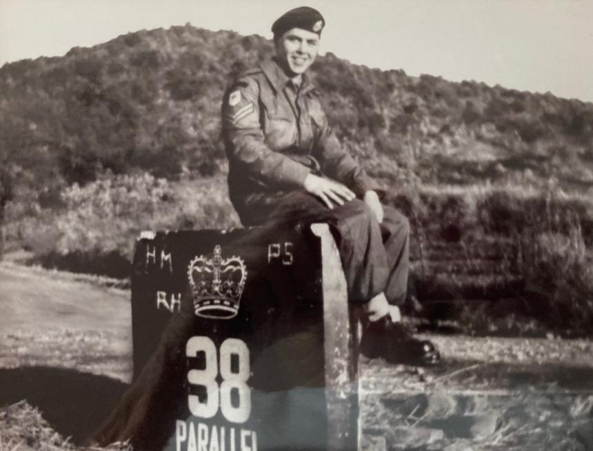 An old picture of Bob in his army days, when he was in Korea in1953. He is pictured wearing uniform, sitting on a box.