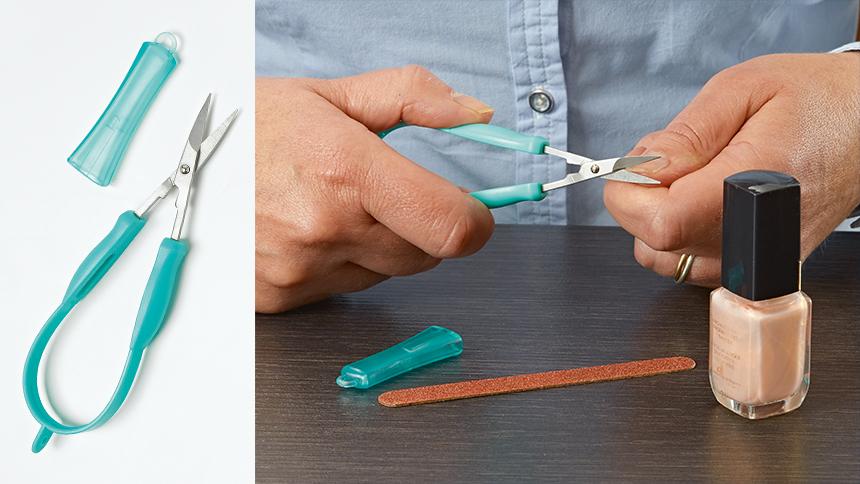 Mini Easi-Grip scissors being used to cut someone's thumbnail