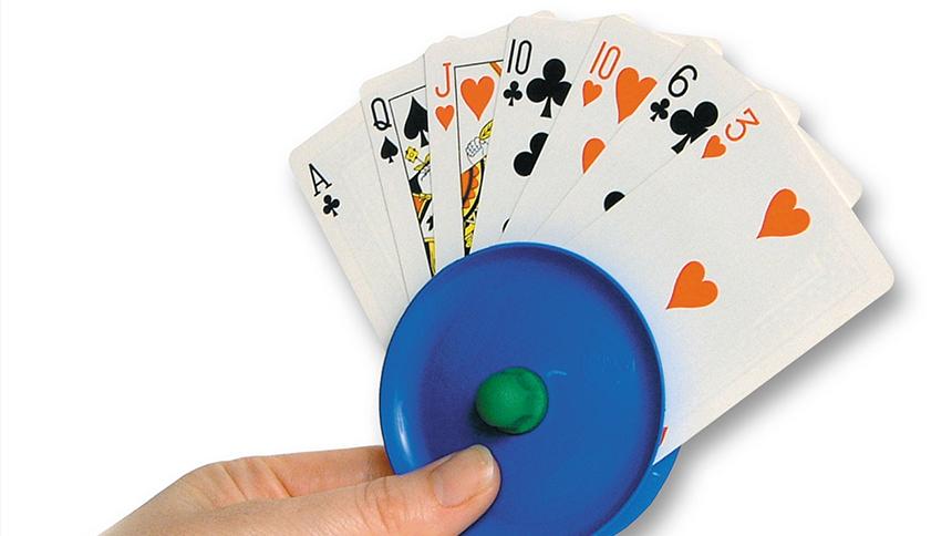 Playing cards in a round, blue plastic card holder