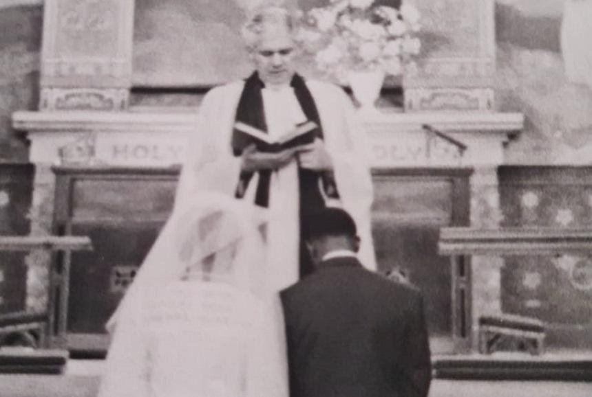 Raymond and Cynthia take their wedding vows in front of a vicar