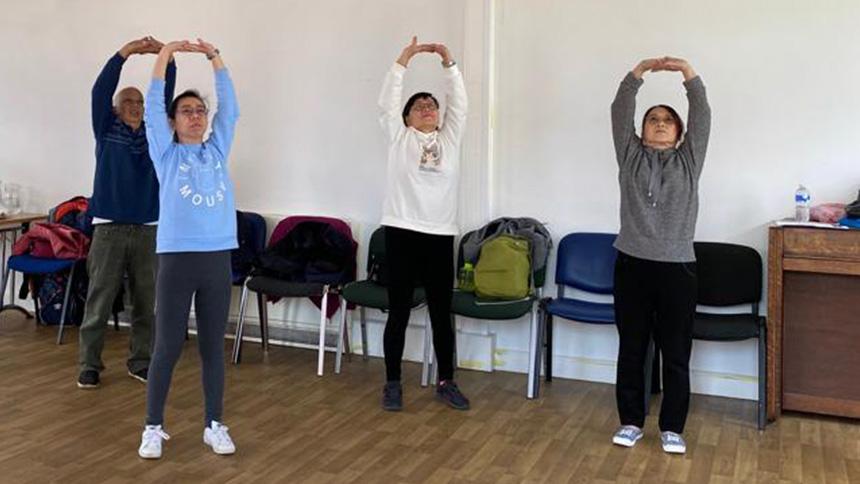 A group takes part in Qigong