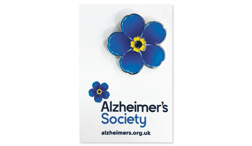 An example of an Alzheimer's Society Forget Me Not mental pin badge