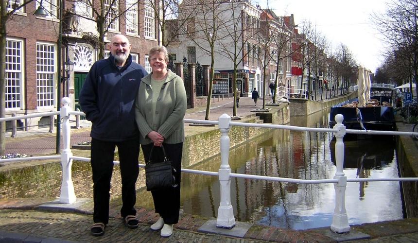 Ian and wife Irene stood on a bridge over a canal in Holland