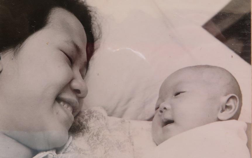 A black and white photo of Ai Lyn (right) as a baby with her mum (left)