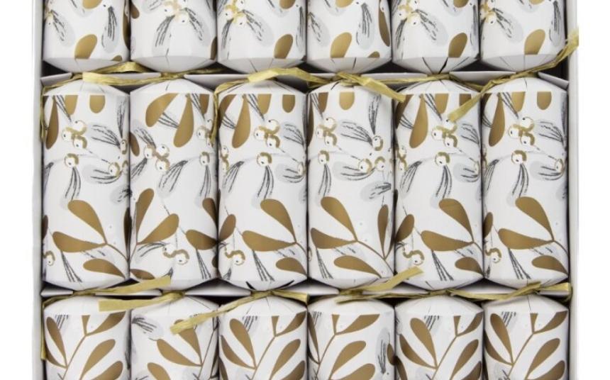 White and gold christmas crackers with a mistletoe design
