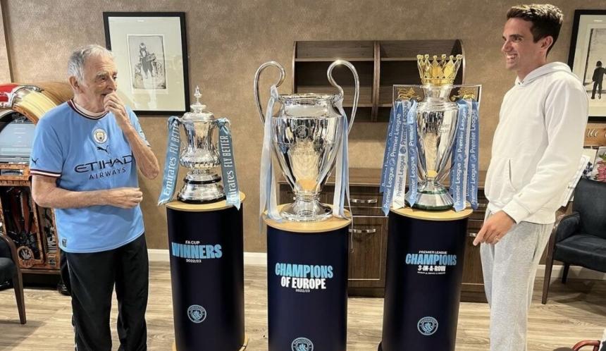 Charlie and his gramps with the trophies from man city's treble winning season