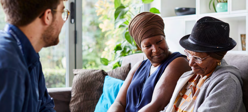 Two women talking to a GP.