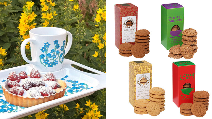 A two handled mug and tray with forget-me-nots and four packets of biscuits