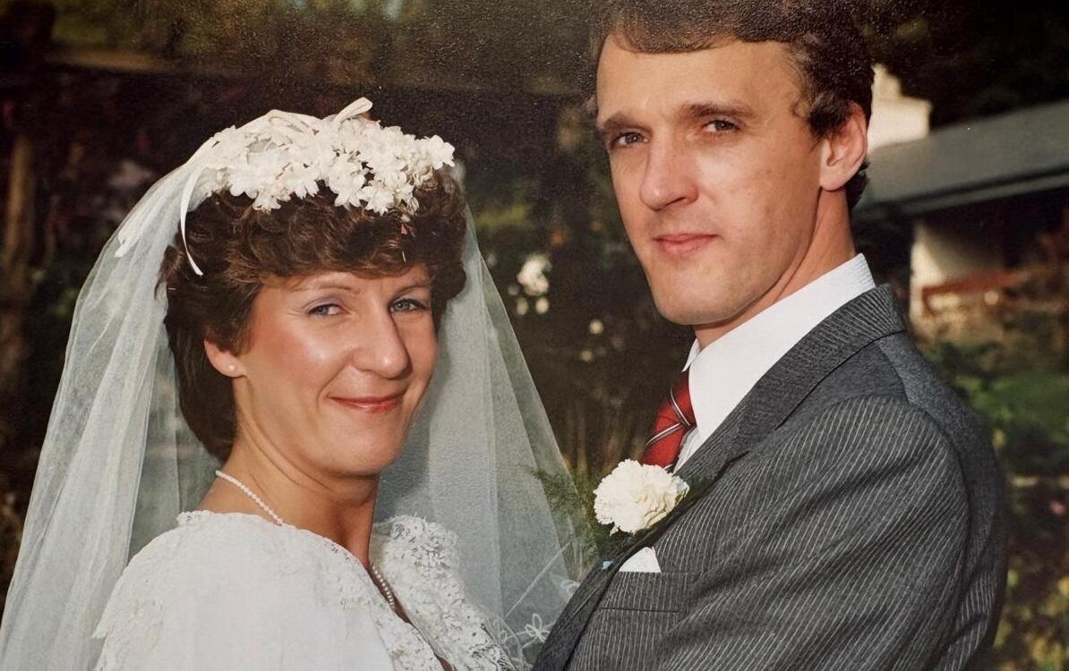 Jan and Ian hug on their wedding day