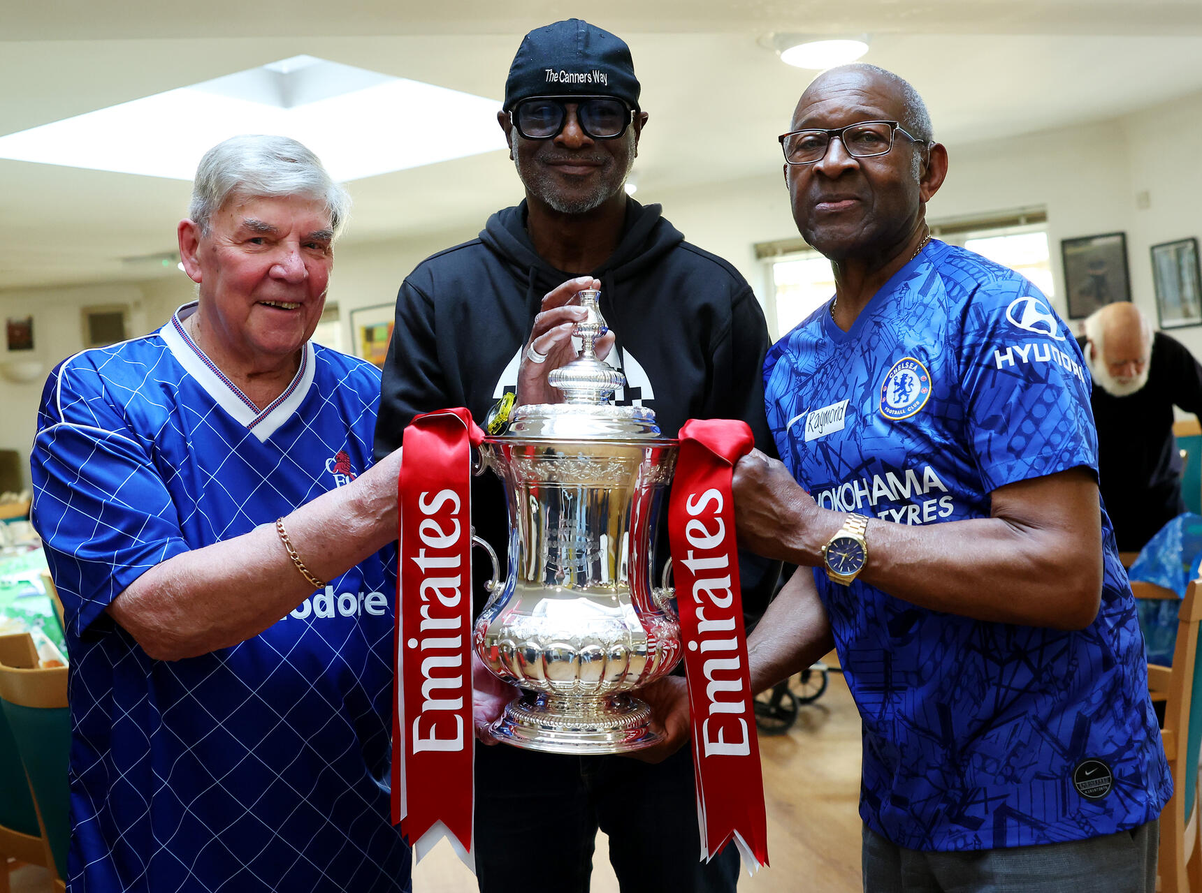 Paul Canoville with two dementia supporters at the Dementia Cafe in Hammersmith