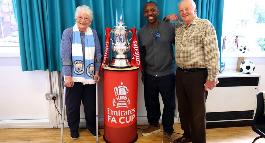 Footballer Shaun Wright-Phillips with two Alzheimer's Society supporters
