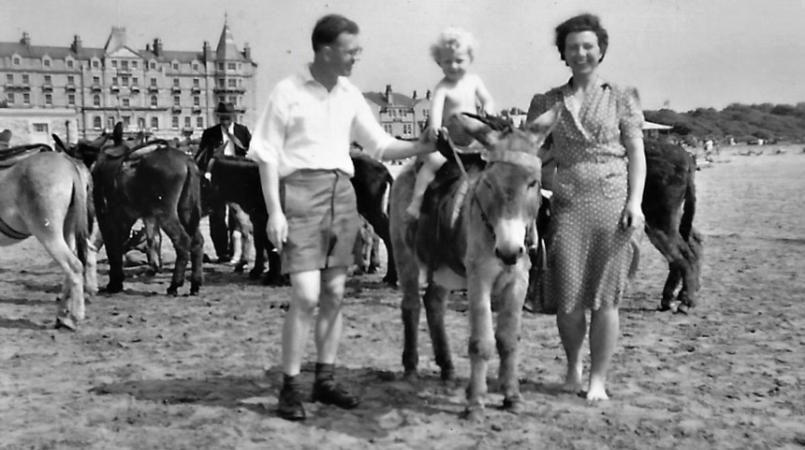 Tony Ward as a child with his parents while riding a donkey
