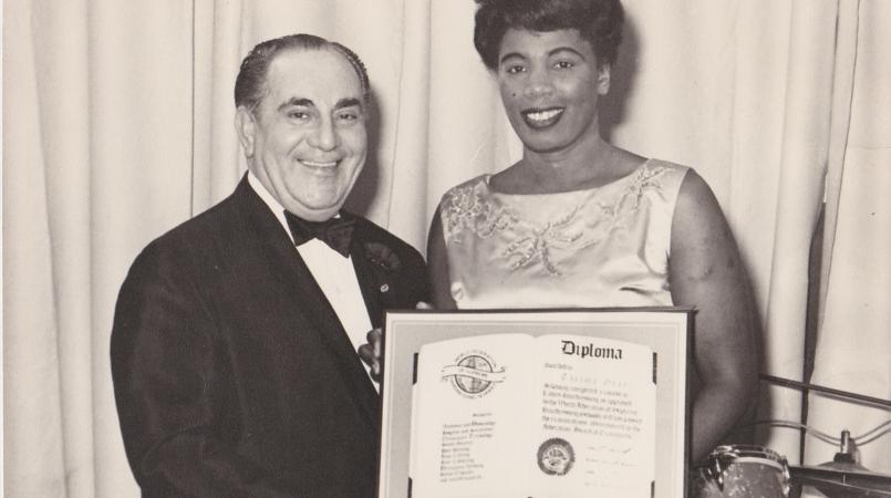 Thelma being awarded her diploma