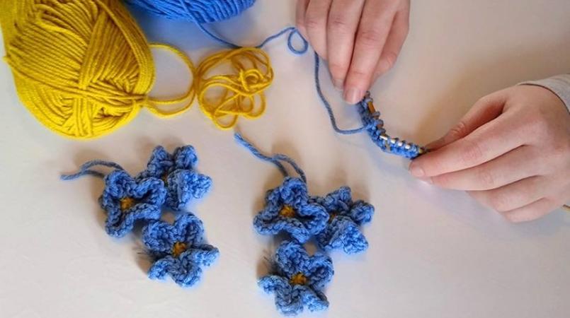 Image of child crafting Forget-me-nots