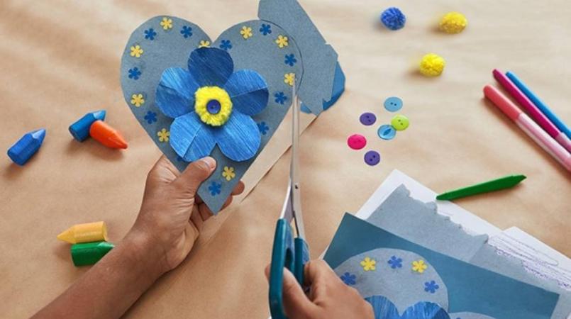 Image of child crafting forget-me-nots cards