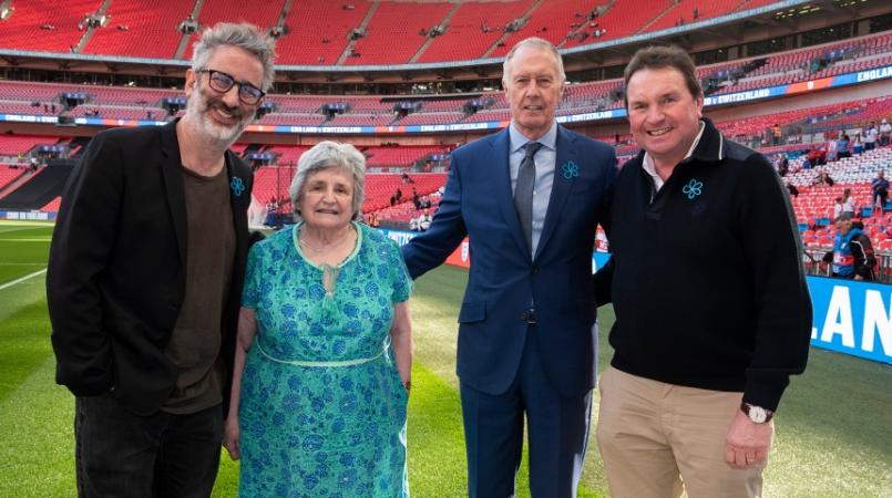 David Baddiel and Sir Geoff Hurst pictured at the match with Shelagh Robinson and Stephen Freer - football fans living with dementia