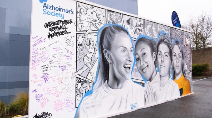 A mural painted outside Brentford stadium of four English Lionesses and writing added by fans